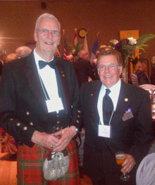 Dr. Robert Scott (in traditional kilt) with Al Brisco, a member of the Rotary Club of Colborne, Ontario, Canada, during the celebration for Scott.