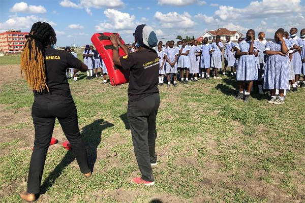 Young women receive training in self defense during a project to empower girls in Kenya.